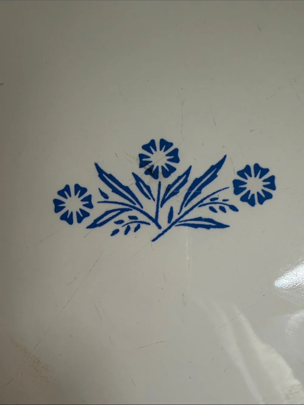Vintage CorningWare 9-inch pie plate featuring the classic Blue Cornflower.